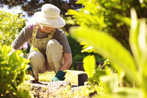 Gardener inspecting a garden with safety vest and clipboard